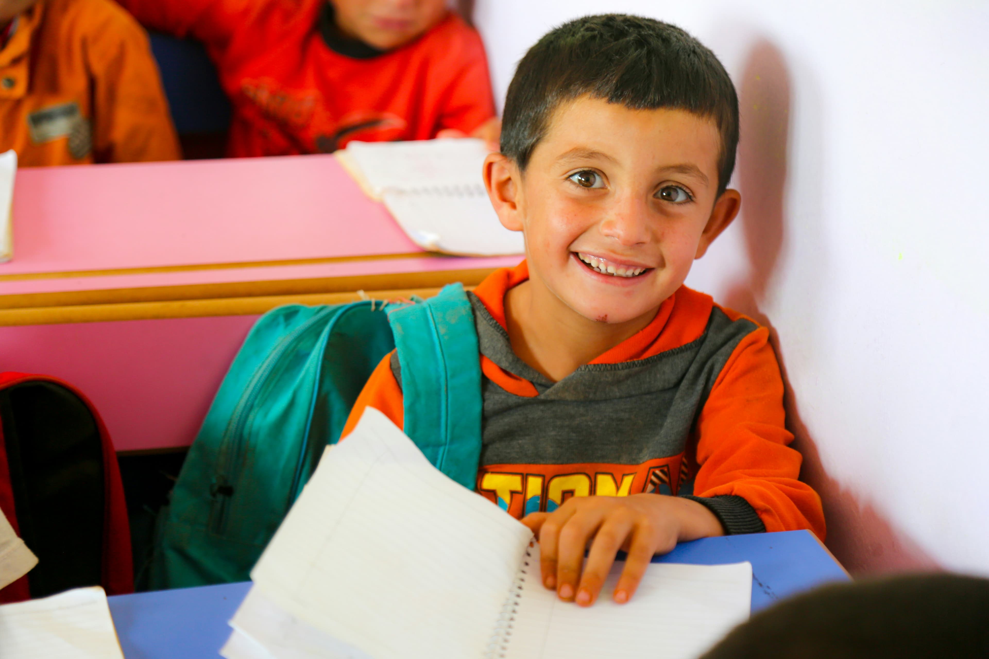 Smiling child holding a book